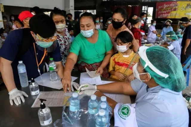 Migrant workers of a seafood market are seen before being tested, amid the coronavirus disease (COVID-19) outbreak, at a seafood market, in Samut Sakhon province, in Thailand, December 19, 2020