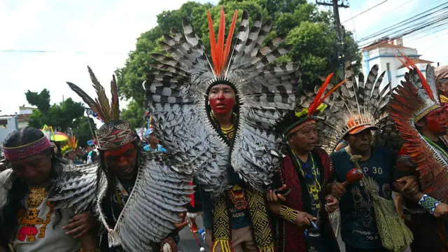 कॉप30 में प्रदर्शनकारियों ने जलवायु परिवर्तन के समाधान की मांग करते हुए मार्च किया