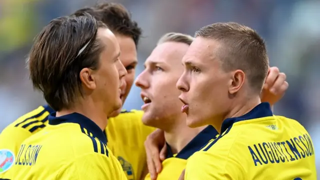 Sweden's players celebrate scoring against Poland at Euro 2020