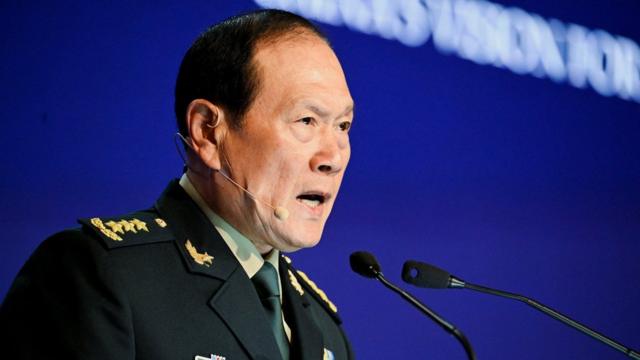 China's State Councilor and Defence Minister General Wei Fenghe speaks at a plenary session during the 19th Shangri-La Dialogue in Singapore 12 June 2022