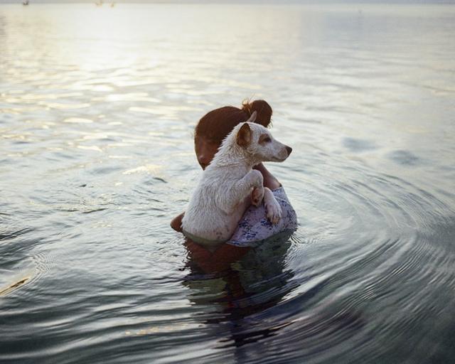 Aurel with her dog, Rote Island, East Nusa Tenggara, Indonesia, 2021