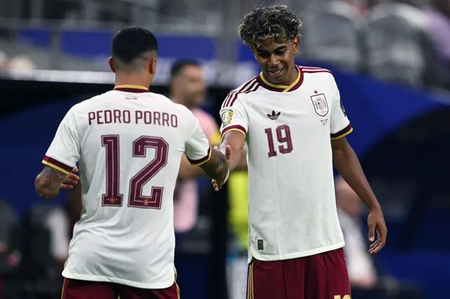 Pedro Porro of Spain celebrates his goal with Lamine Yamal of Spain during the FIFA World Cup 2026 Semi Final match between France and Spain at Dallas Stadium on July 14, 2026 in Arlington, Texas. 