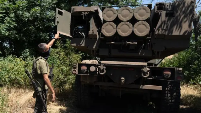 A Ukrainian soldier with a Himars rocket system