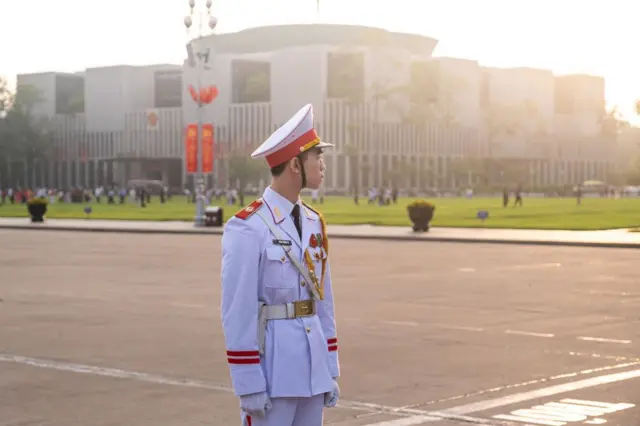 A soldier during the flag rising ceremony at Ba Dinh Square in Hanoi, Vietnam, on Tuesday, May 14, 2024. The Vietnam National Assembly Building can be seen in the background. The parliament is scheduled to begin its summer session May 20, according to seperate statement on the government's website.'s website.