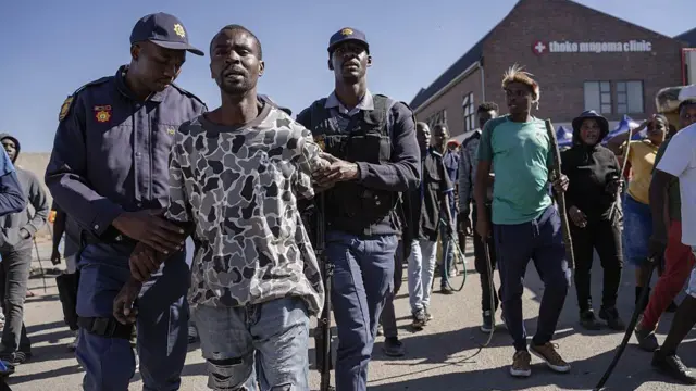 South Africa police hold man
