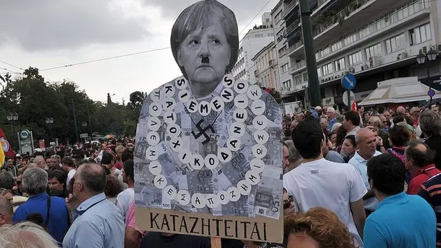 Cartaz contra Merkelaposta na pixbetAtenas