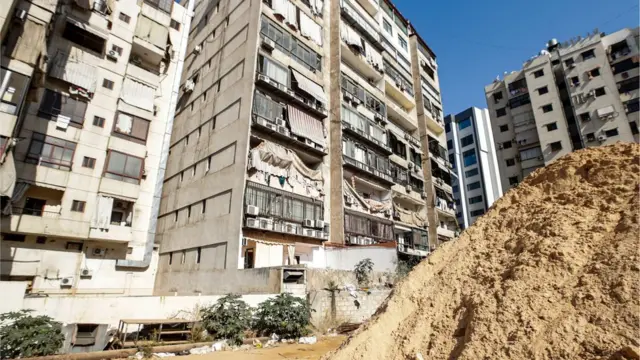 This picture taken on August 25, 2019 shows damage to a building housing a media centre of the Lebanese Shiite group Hezbollah in the south of the capital Beirut, after two drones came down in its vicinity earlier in the day.