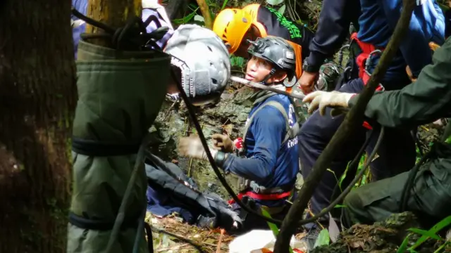 Rescue workers attempt to drill a hole to access the Tham Luang Nang Non cave in northern Thailand