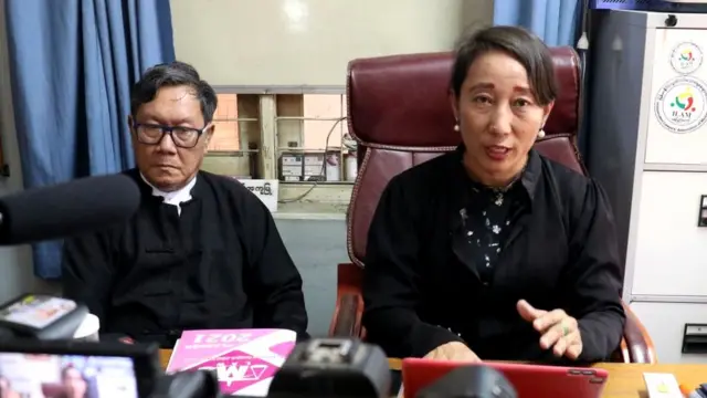 Min Min Soe (R) and Khin Maung Zaw (L), lawyers representing detained Myanmar leader Aung San Suu Kyi, address members of the media at Khin Maung Zaw's house in Naypyidaw on May 24, 2021, as Suu Kyi made her first in-person court appearance since the military coup in February.