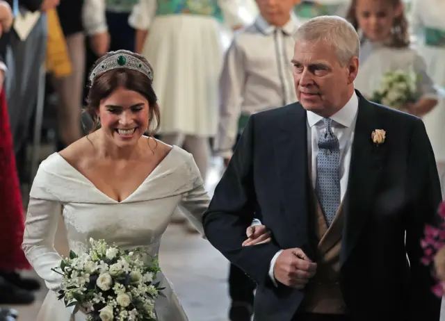 Princess Eugenie walks down the aisle with her father, Prince Andrew, the Duke of York, f