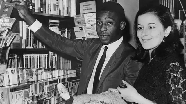 Pele and Rose in a bookshop in Paris.