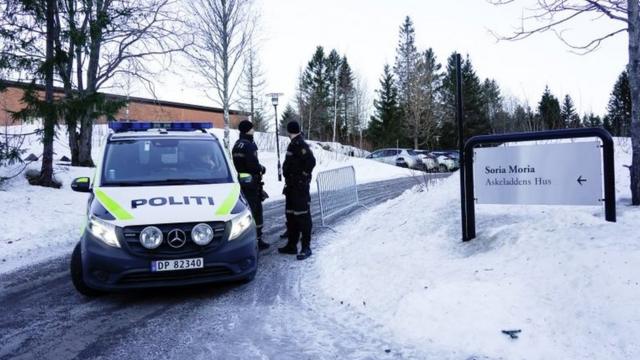 Police guard a road leading to the hotel in Oslo