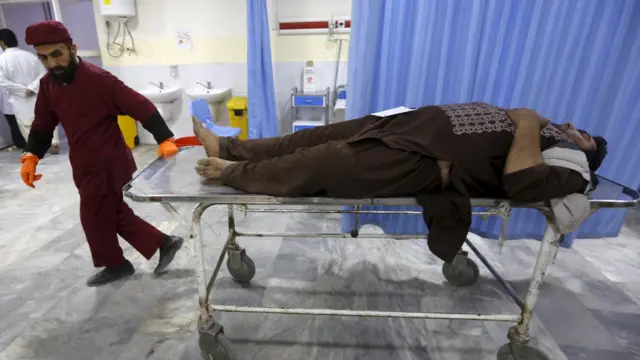 An Afghan man arrives for treatment at a hospital after a suicide car bomb attack in Kabul, Afghanistan on 19 April 2016