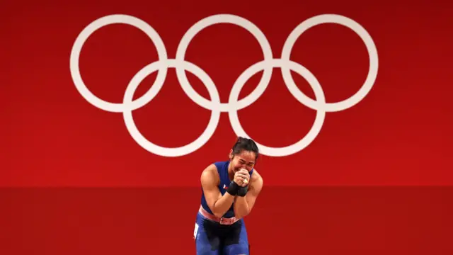 26 July: Hidilyn Diaz of the Philippines celebrates a historic victory as her country's first ever gold medal winner during the women's weightlifting 55kg on day three of the Tokyo Olympics