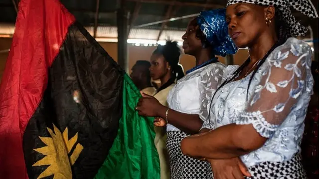 One woman hold one Biafran flag for one service for St. Martin Catholic of Tours Church May 28, 2017 inside Aba-South district, Abia State Nigeria