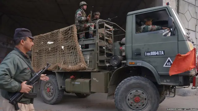 An Indian Army truck transports troops to the air force base in Pathankot on January 4, 2016.