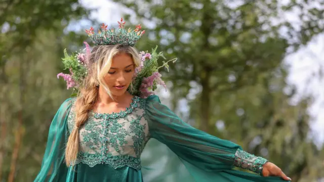 Model Lydia Butler representing The Mistress of Ural Mountains pictured in front of the RHS Queens Green Canopy Garden. RHS Queens Green Canopy Garden is the largest plot at the Chelsea Flower Show, featuring 21 trees and more than 3,500 plants to highlight the importance of trees and woodland.