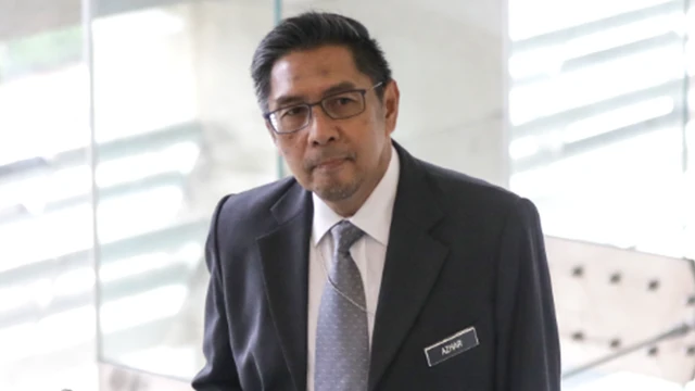 MH370 Response Team leader Azharuddin Abdul Rahman arrives at the ministry of transport headquarters in Putrajaya, Malaysia, 30 July 2018