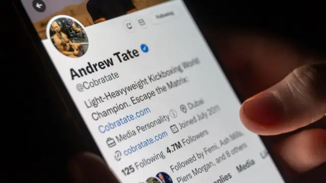 Andrew Tate's Twitter profile open on a mobile phone screen
