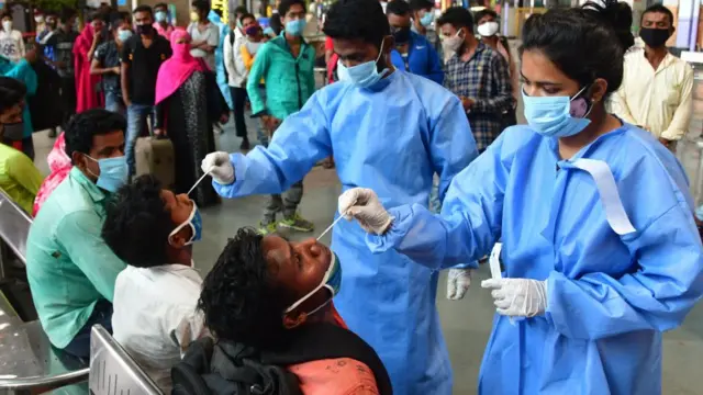 Travellers at Chhatrapati Shivaji Maharaj Terminus (CSMT) railway station being screened for Covid-19, on April 14, 2021 in Mumbai, India