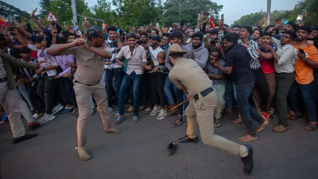 Police officers try to control fans of the Royal Challengers Bengaluru (RCB) and get them to disperse from outside the M. Chinnaswamy Stadium on June 04, 2025 in Bengaluru, India.