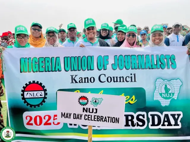 NUJ members for Kano hold banner to celebrate May Day