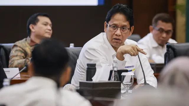 Menteri Keuangan Purbaya Yudhi Sadewa saat mengikuti sidang aduan kanal Debottlenecking Satgas P2SP di Gedung Kementerian Keuangan, Jakarta, Senin (26/1/2026).