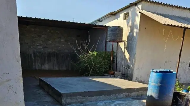 Concrete slab covering the septic tank where Chandrakar's body was discovered