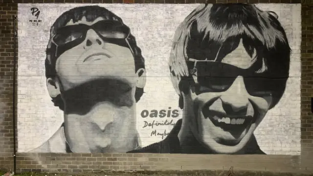 Mural appears on Manchester record shop featured in Oasis track