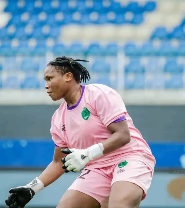 Rachael Onachukwu wear pink jersey as she dey in action for di club.