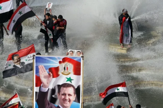 شادی حامیان بشار اسد همراه با تصویری از او