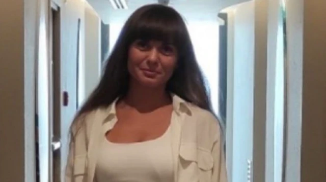 Ирина Левина, темноволосая женщина в белой рубашке