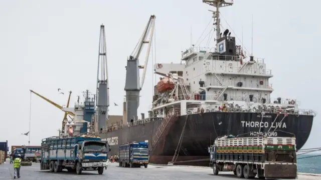 Trucks loaded with food rations from the Thorco Liva ship, leave Berbera port, Somaliland