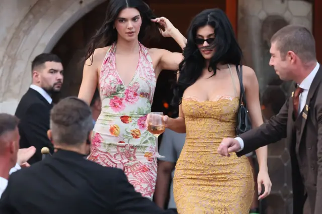 Kylie Jenner and Kendall Jenner for Venice, Italy, for di wedding of Jeff Bezos and Lauren Sanchez. Kendall wear one floral print dress and Kylie wearing a yellow dress.
