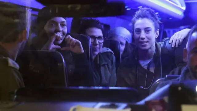 Freed Israeli hostages on a bus, November 2023