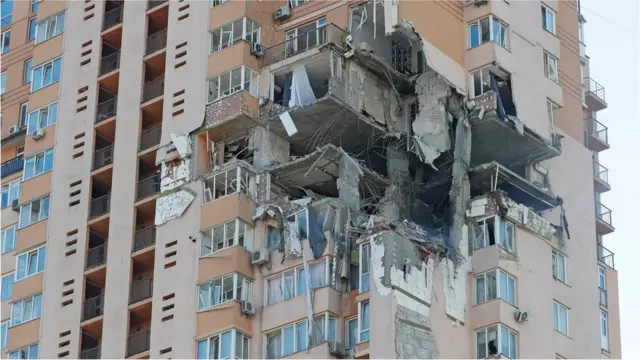 A view shows an apartment building damaged by recent shelling in Kyiv, Ukraine 26 February