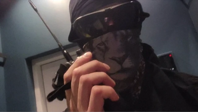 A member of the Squad 303/Anonymous hacker group