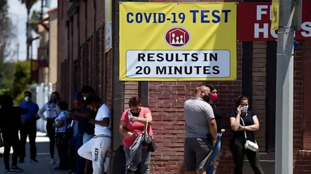 Long Beach, California: People stand in line at a clinic offering quick coronavirus testing for a fee.