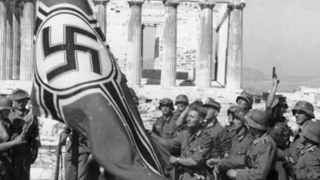 German soldiers raising the German war flag over the Acropolis