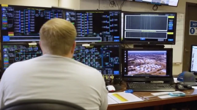 man at pipeline terminal