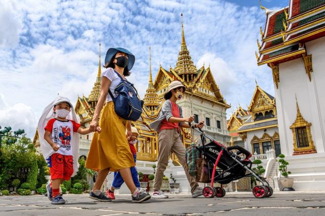 People visit the Grand Palace in Bangkok on June 7, 2020
