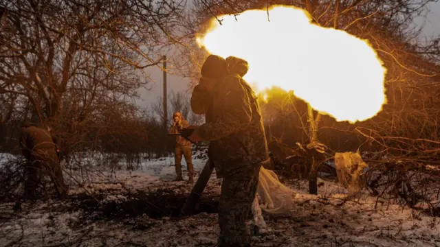  Ukrainian soldiers of 57 brigade fire a mortar at their fighting position in the direction of Kupiansk