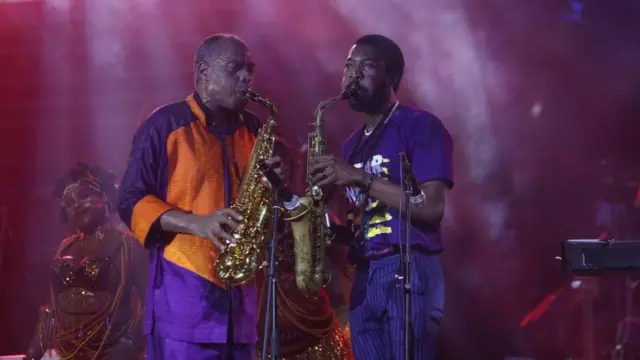 Femi Kuti (L), son of Nigerian Afrobeat legend Fela Anikulapo-Kuti, performs on stage with his son Made Kuti during the annual concert in honour of their father and grandfather in Lagos, on Sunday.