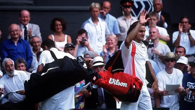 Sampras leaves the court as Federer celebrates
