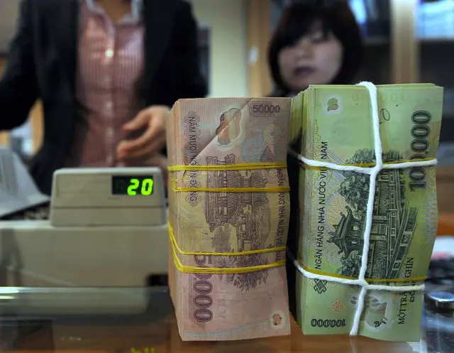 Áp lực tỉ giá