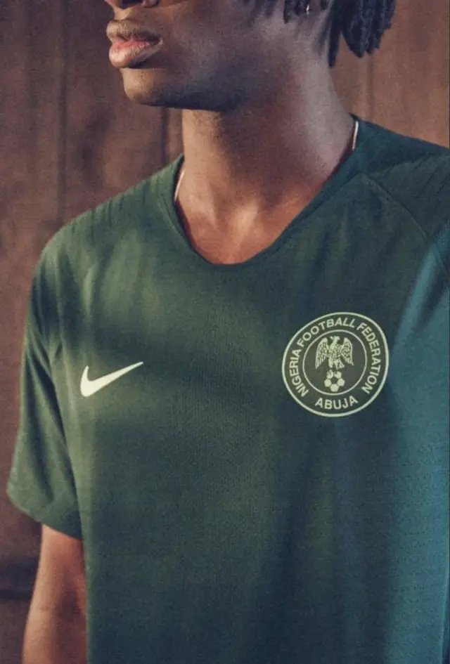 Model wey wear Super Eagles green jersey