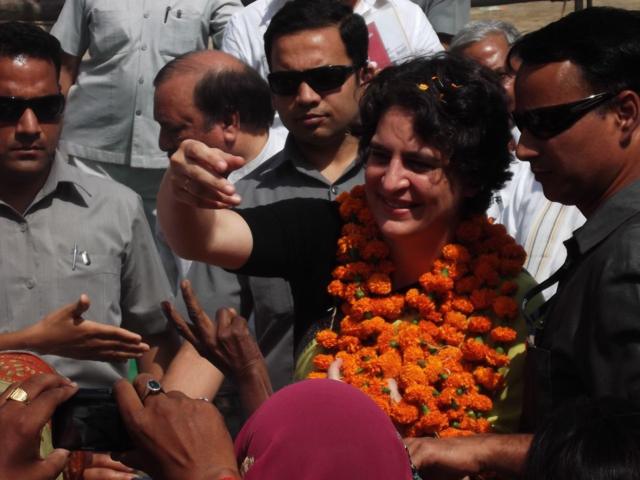 Priyanka Gandhi waving to supporters during election campaign in Amethi. 2014