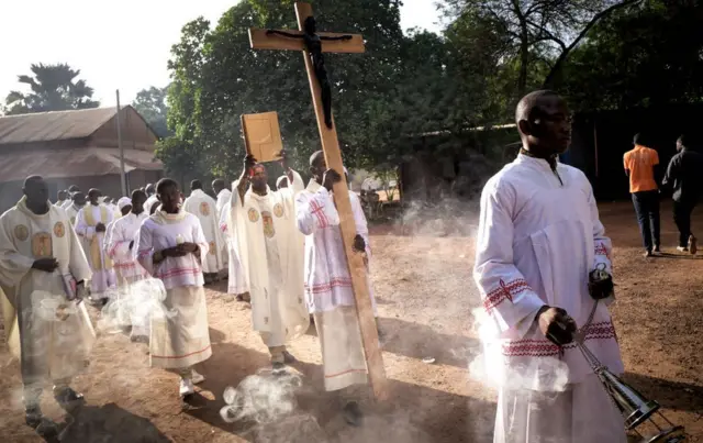 Altar servers are seen during a procession before the liturgy in the occasion of the National Pilgrimage in Kita on November 22, 2020. - Since 1966, when the bishops of Mali decided to make Kita the site of a National Pilgrimage, the faithfuls made the journey to the holy sanctuary of Kita where the statue venerated as Notre Dame de Mali is situated. The central theme of this year's gathering is reconciliation of Mali and the freedom of Sister Gloria, kidnapped three years before in Sikasso.