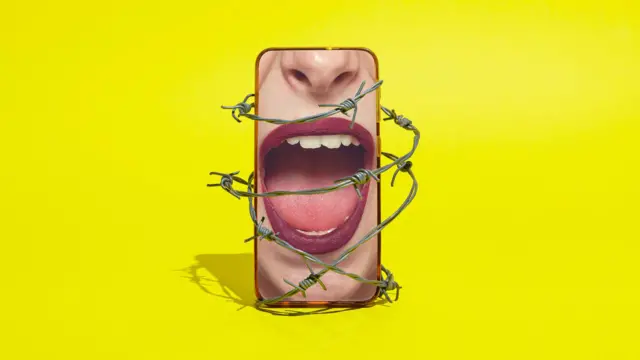 Teléfono inteligente con una boca de mujer gritando envuelta en alambre de púas sobre un fondo amarillo.