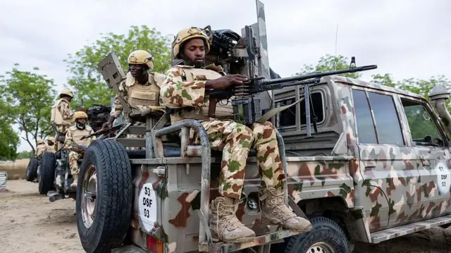 A Nigerian soldier from the Multinational Joint Task Force (MNJTF) loads his machine gun during training at the MNJTF military base, Sector 3 Headquarters, in Monguno, Borno state, Nigeria, on July 5, 2025